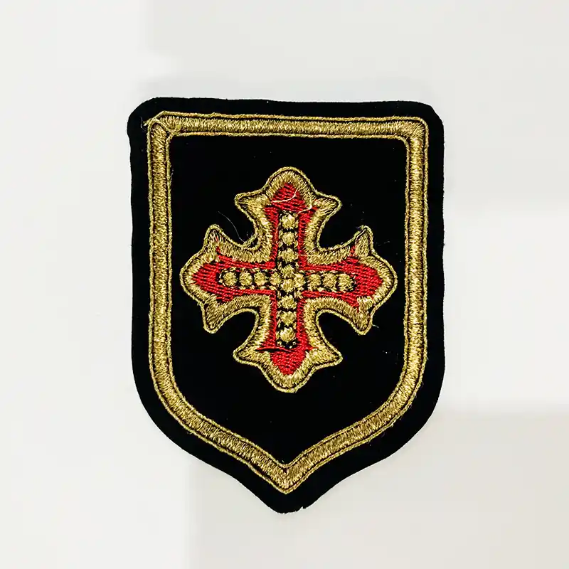 APLIQUE BORDADO TERCIOPELO ESCUDO DANIEL 75MM X 6UN