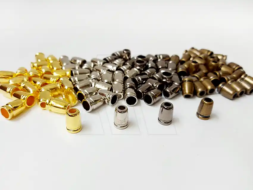 TERMINAL DE CORDON NYLON SIMIL METALICO X DOC 703